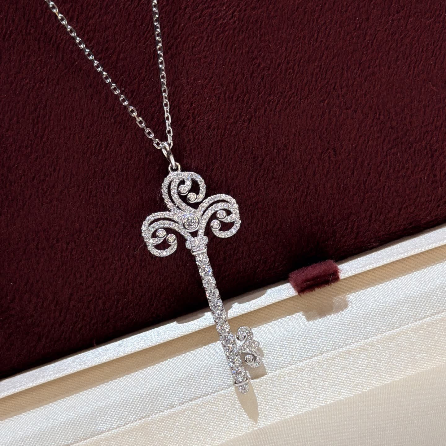 Tiffany & Co Elegant Silver Key Pendant with Diamonds